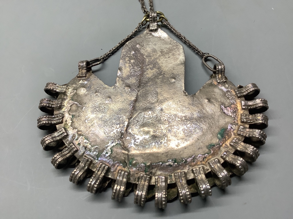 An Afghan? parcel gilt white metal and cabochon lapis lazuli demi-lune shaped pendant necklace